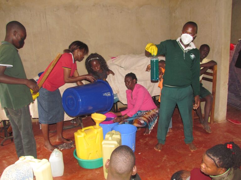 Children learn how to make liquid soap